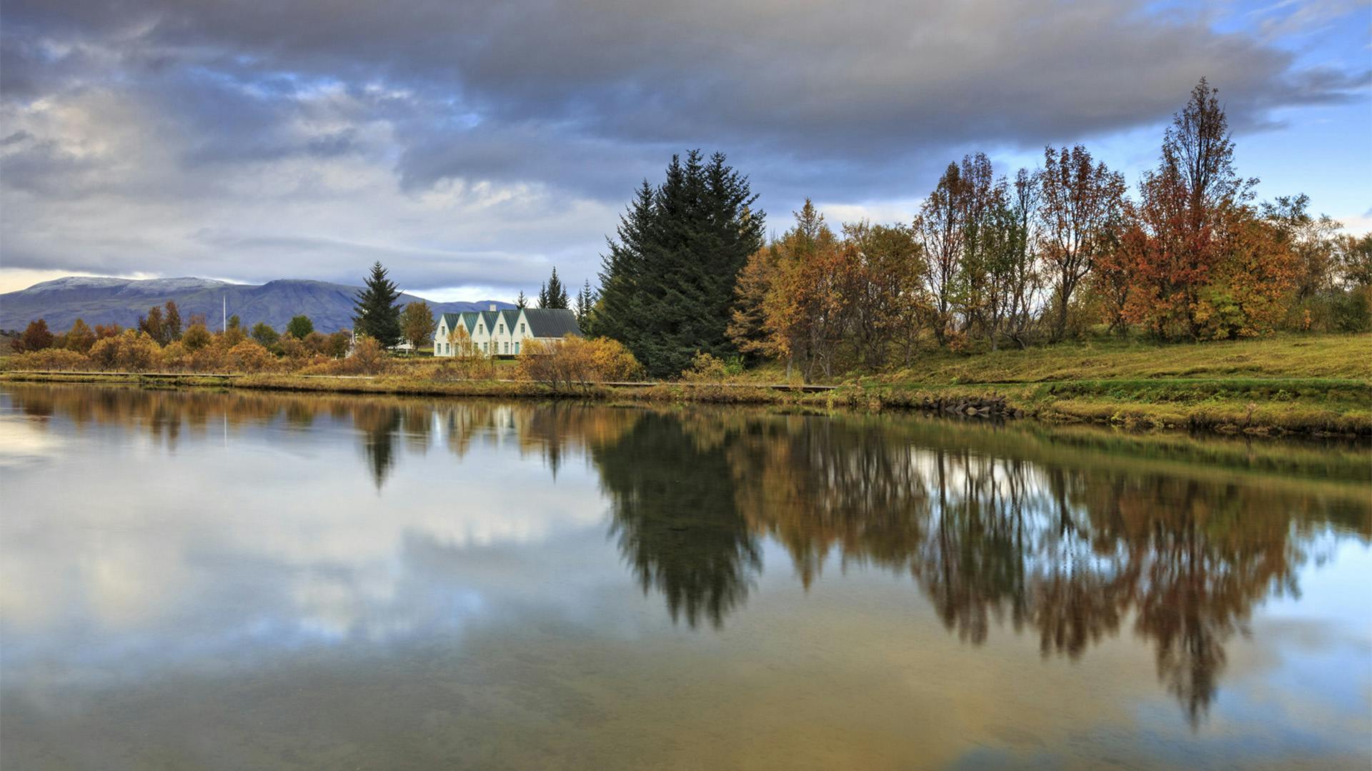 Autumn landscape reflecting on the river.