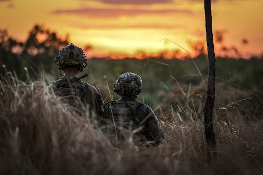 soldiers on exercise at sunset