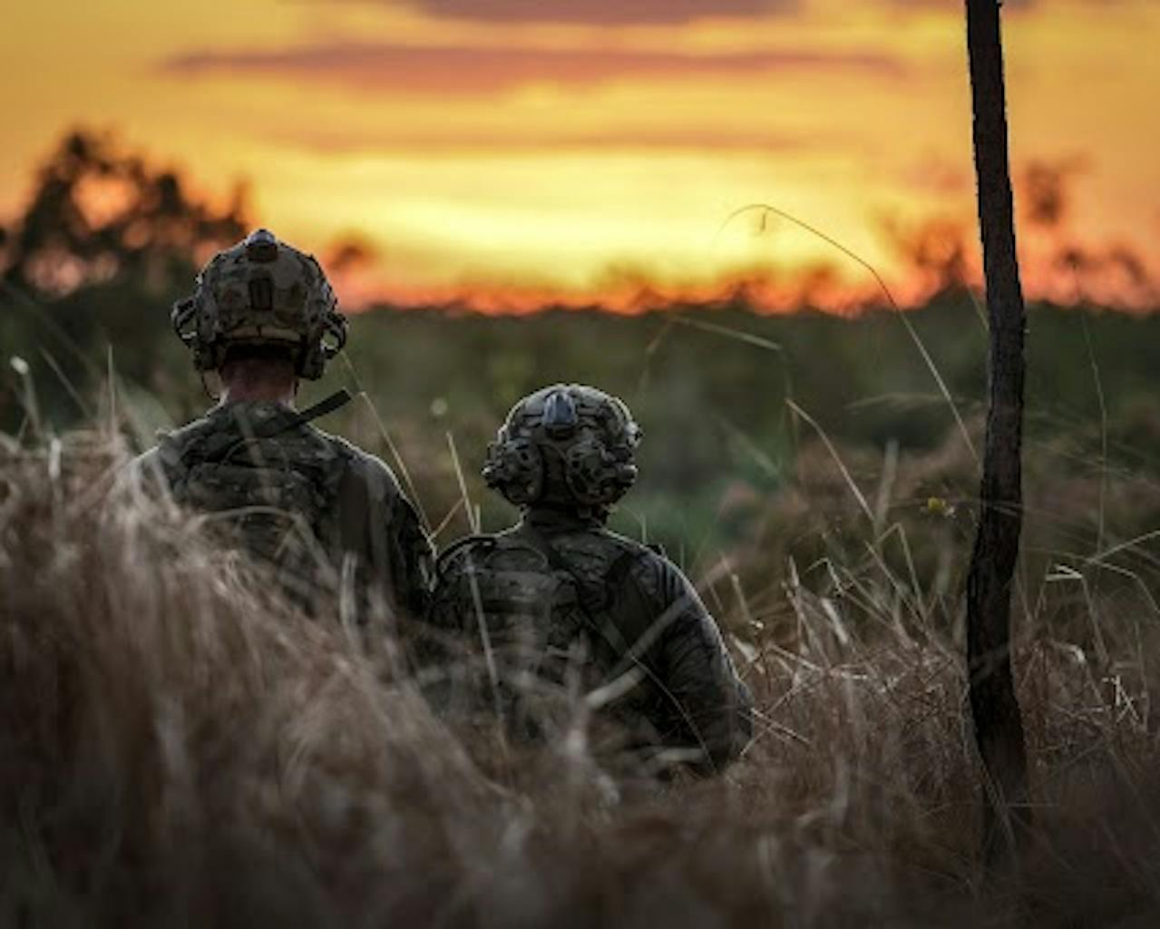 soldiers on exercise at sunset