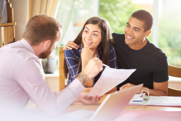 couple receiving good news from advisor