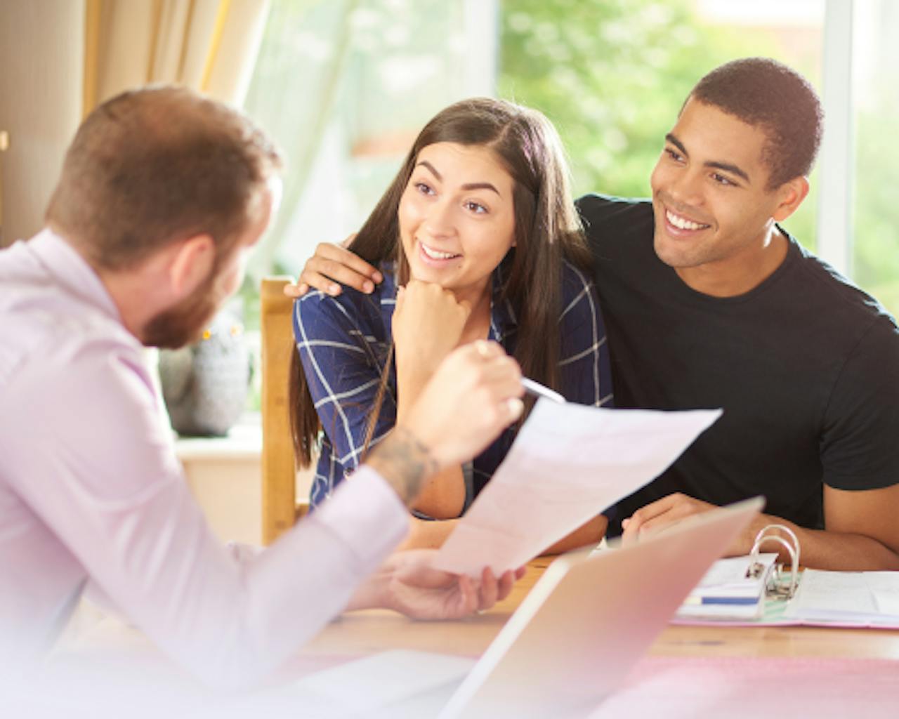 couple receiving good news from advisor