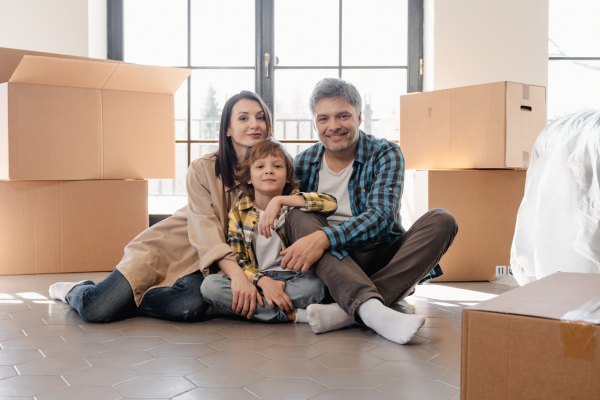 veteran family in new home surround by moving boxes