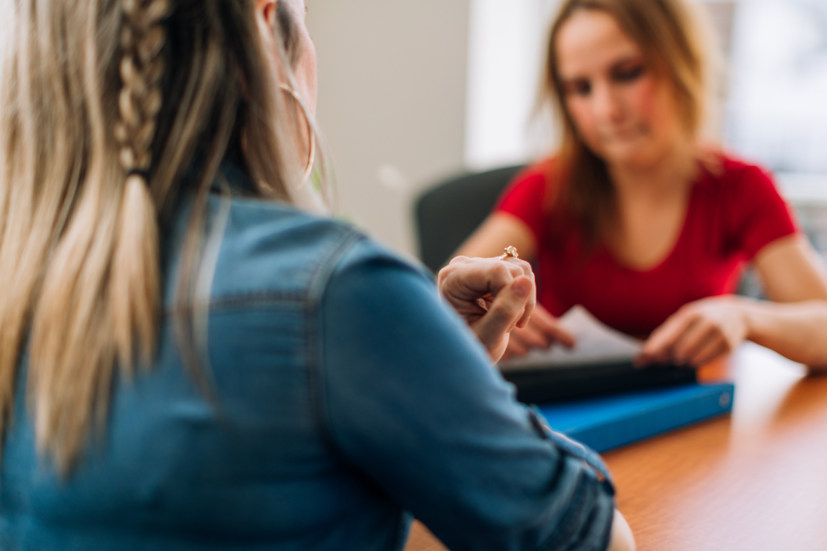 woman receiving help from a social worker