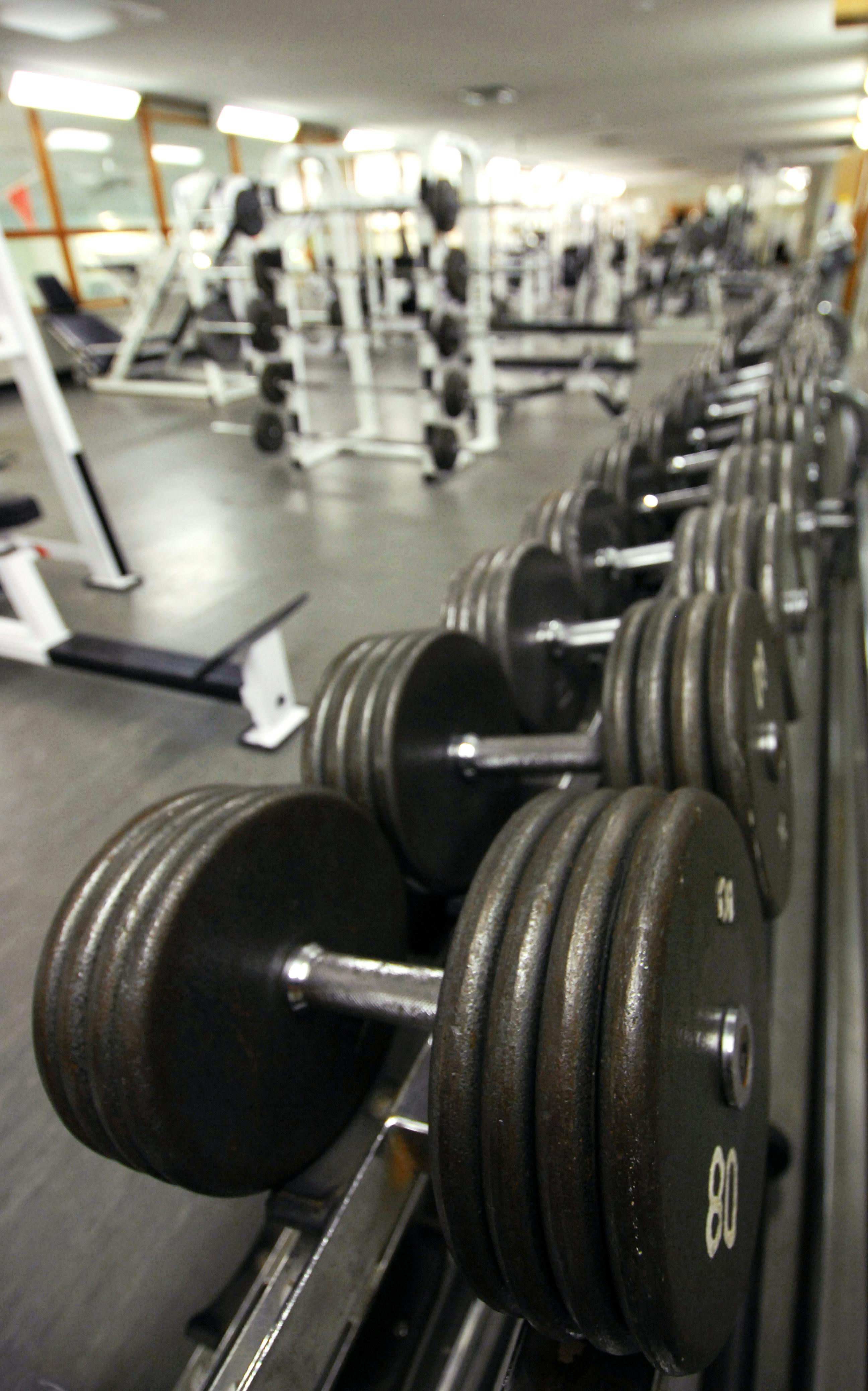 rack of dumbbells in military gym