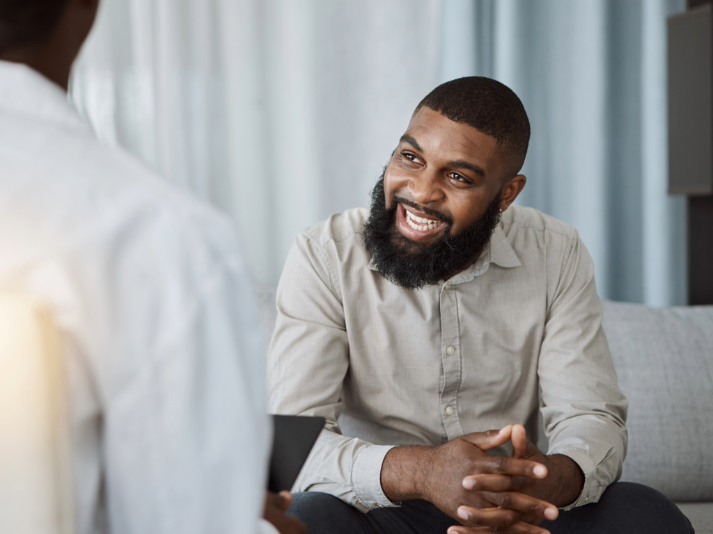 a veteran smiling as he has received support for advice around military discharge