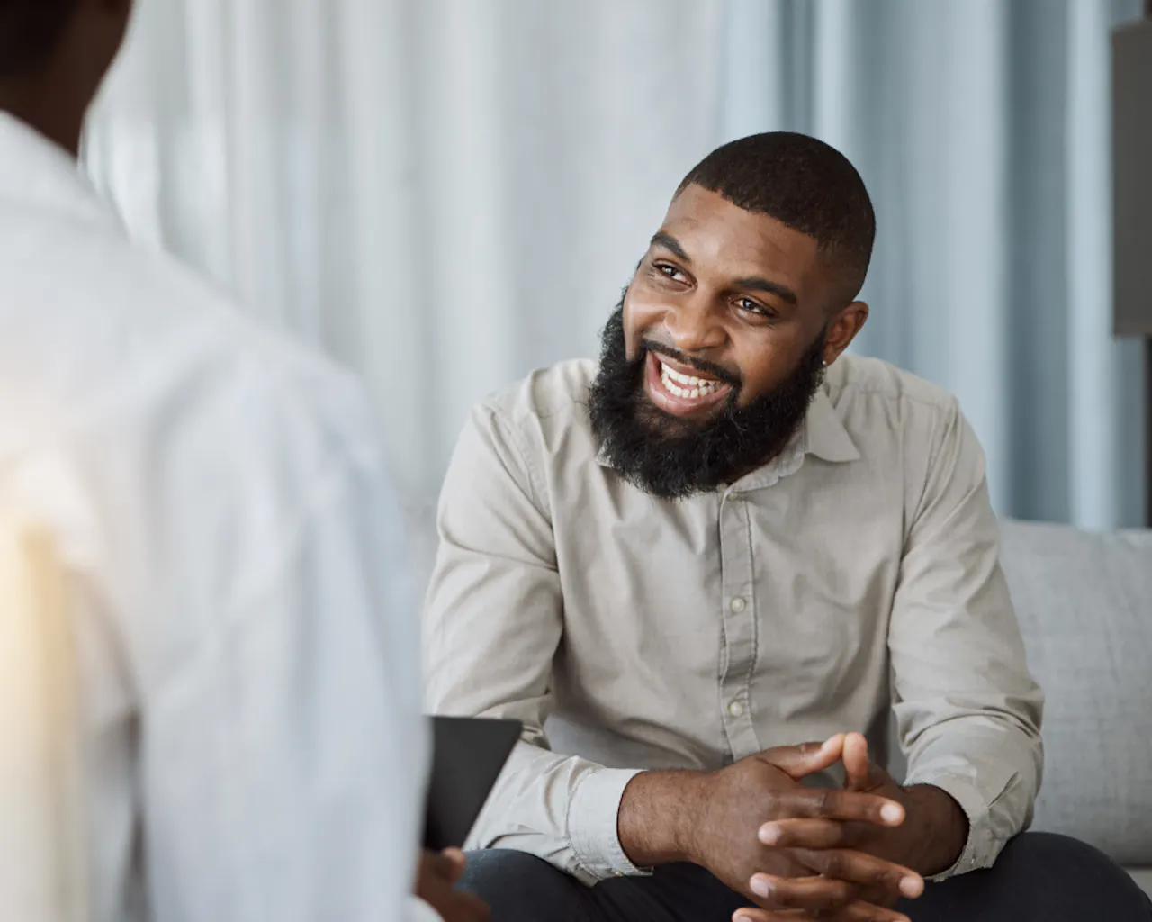 a veteran smiling as he has received support for advice around military discharge