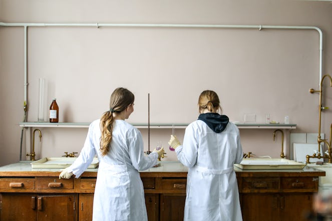Women Cosmetic Chemists Testing Safety of Ingredients for Body Care Formula