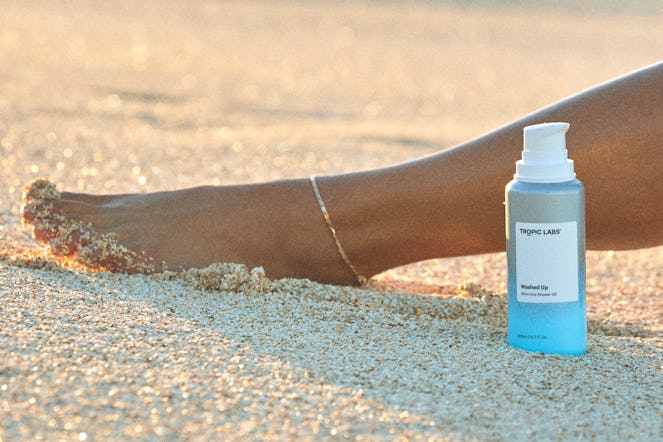 Girls Feet Foot Pedicure Beautiful Tan Toes with Ankle Bracelet Toes on thee Beach in th Sand