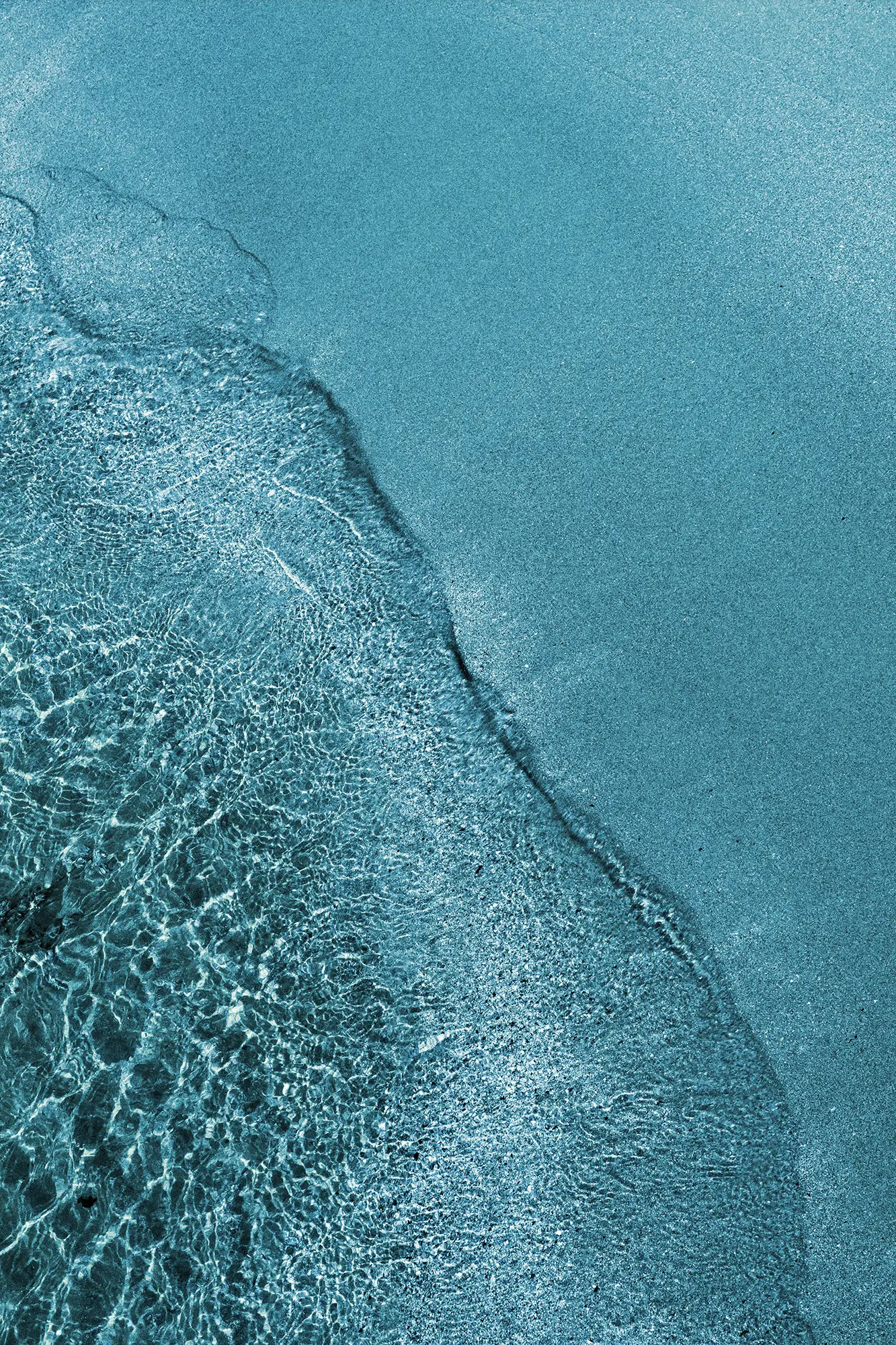 Aerial view of a rich blue body of water