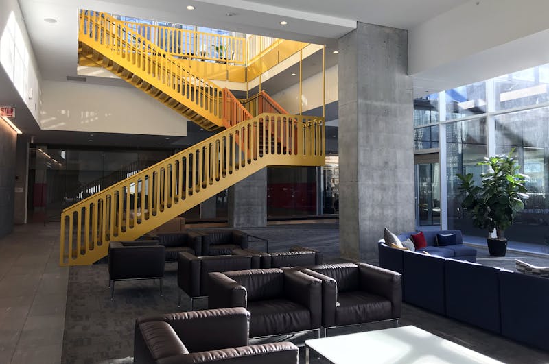 Office lobby connecting to building amenities.
