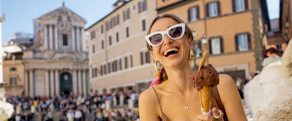 A woman eating ice cream in Rome