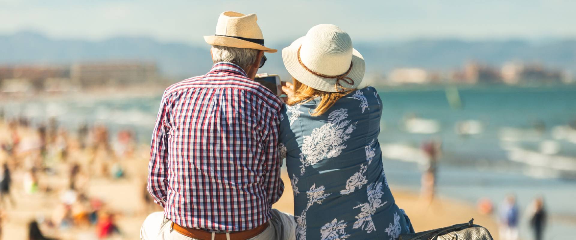 Senior travellers at a beach