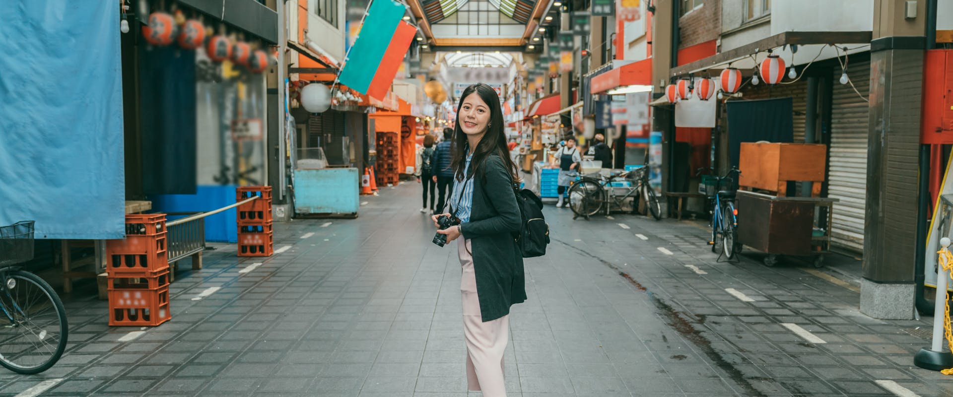 A woman walks through the streets of Tokyo.