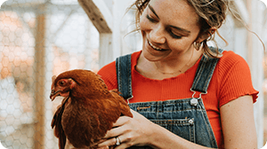 A woman and a chicken