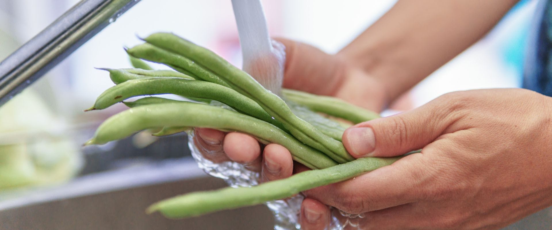 Person washing green beans