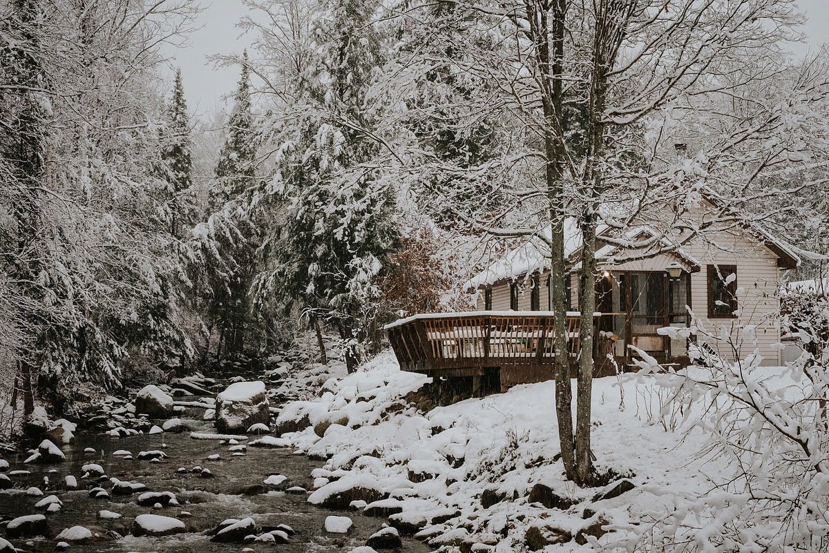 cabin in a snowy woodland scene