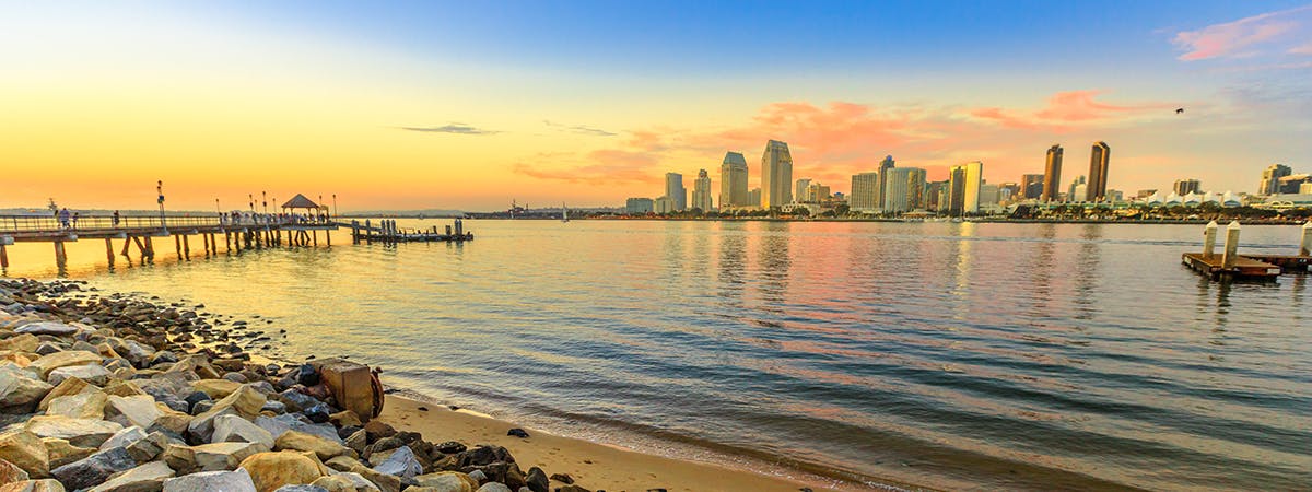 Scenic sunset on San Diego Bay from old wooden pier in Coronado Island, California, USA