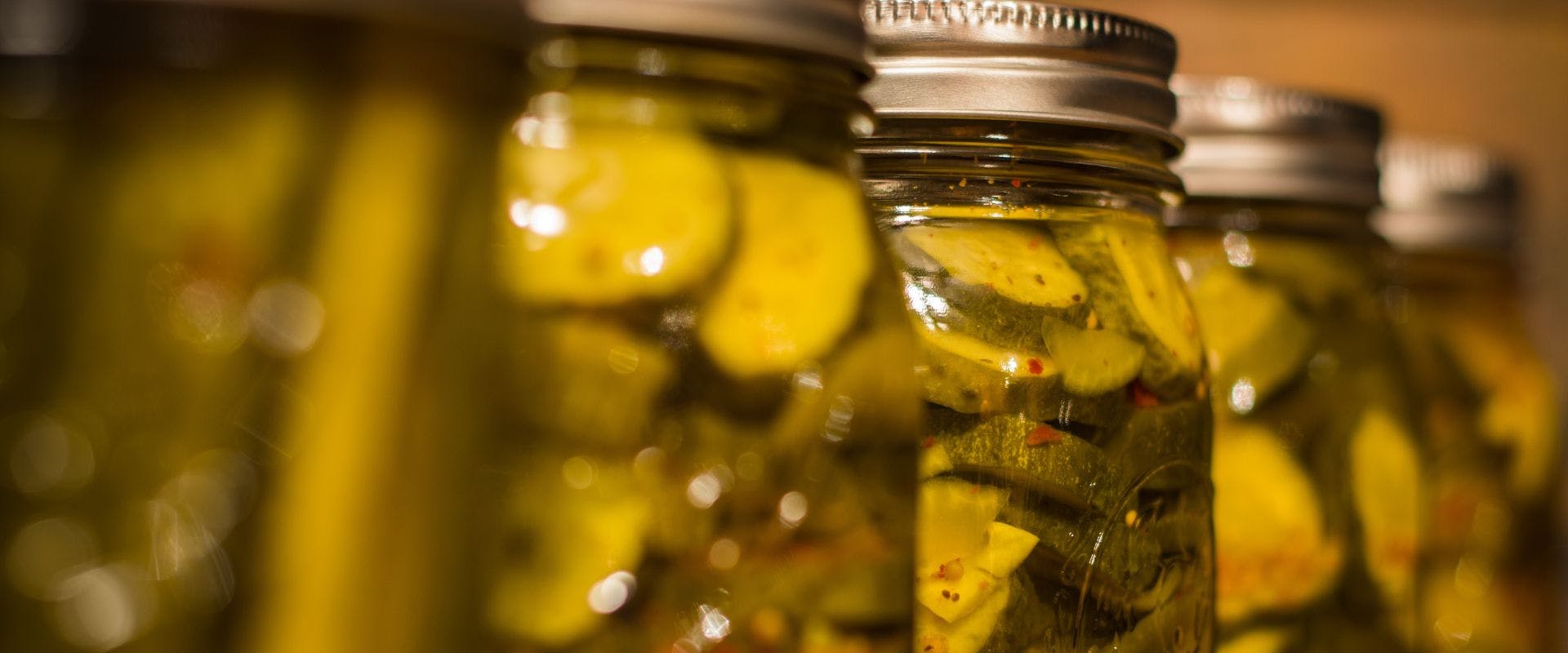 Multiple jars of pickled cucumber