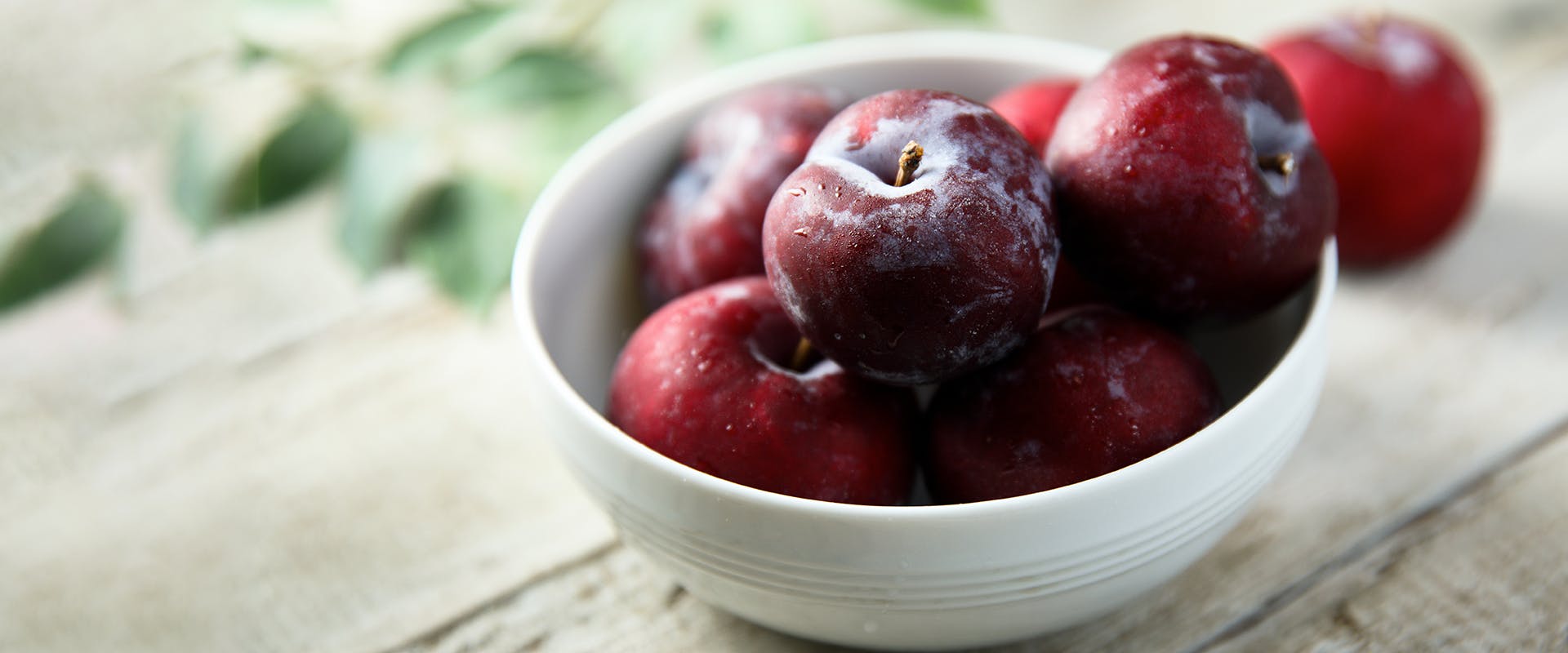 A bowl of fresh plums