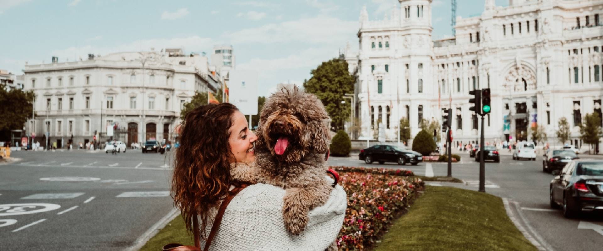 Woman cuddling a dog in Madrid