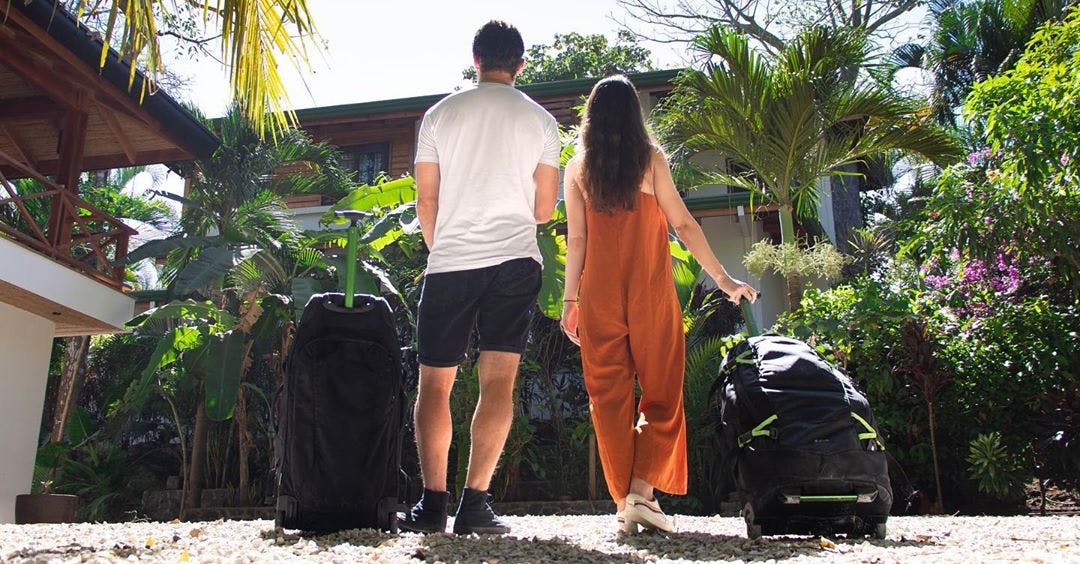 Man and woman with suitcases