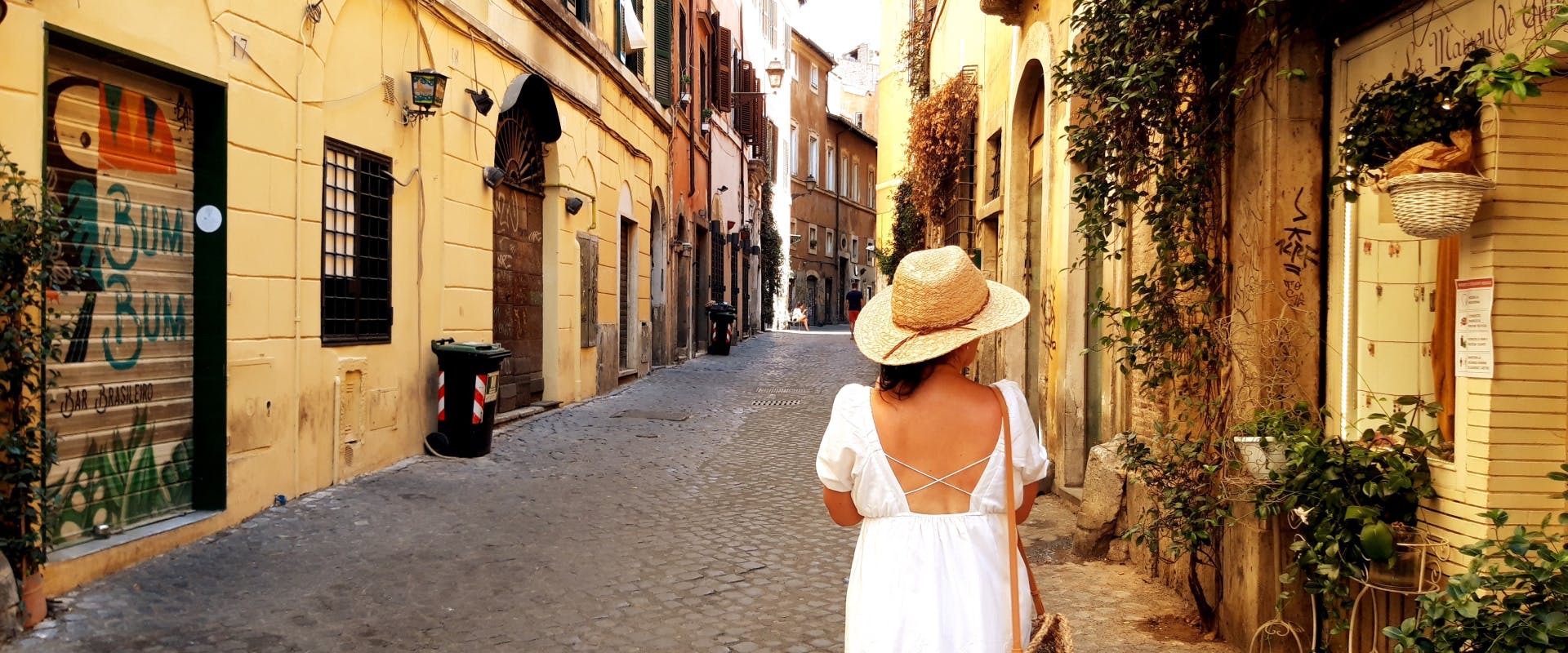 A woman walks through the streets of Italy.