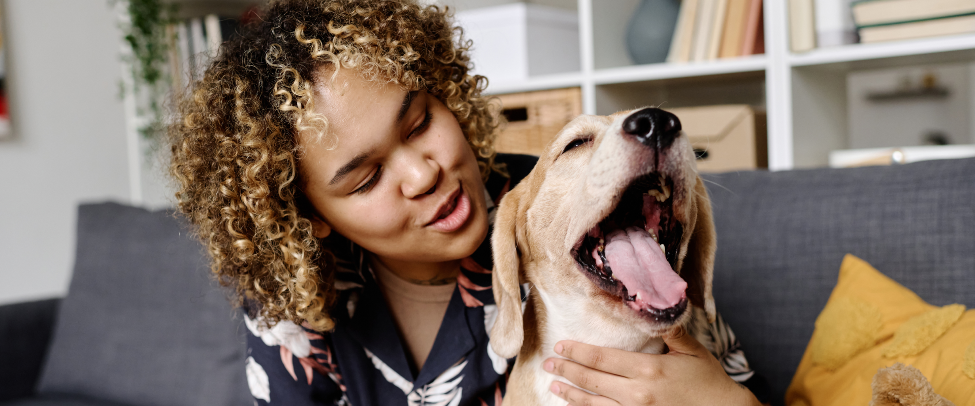 A woman and her dog talk.