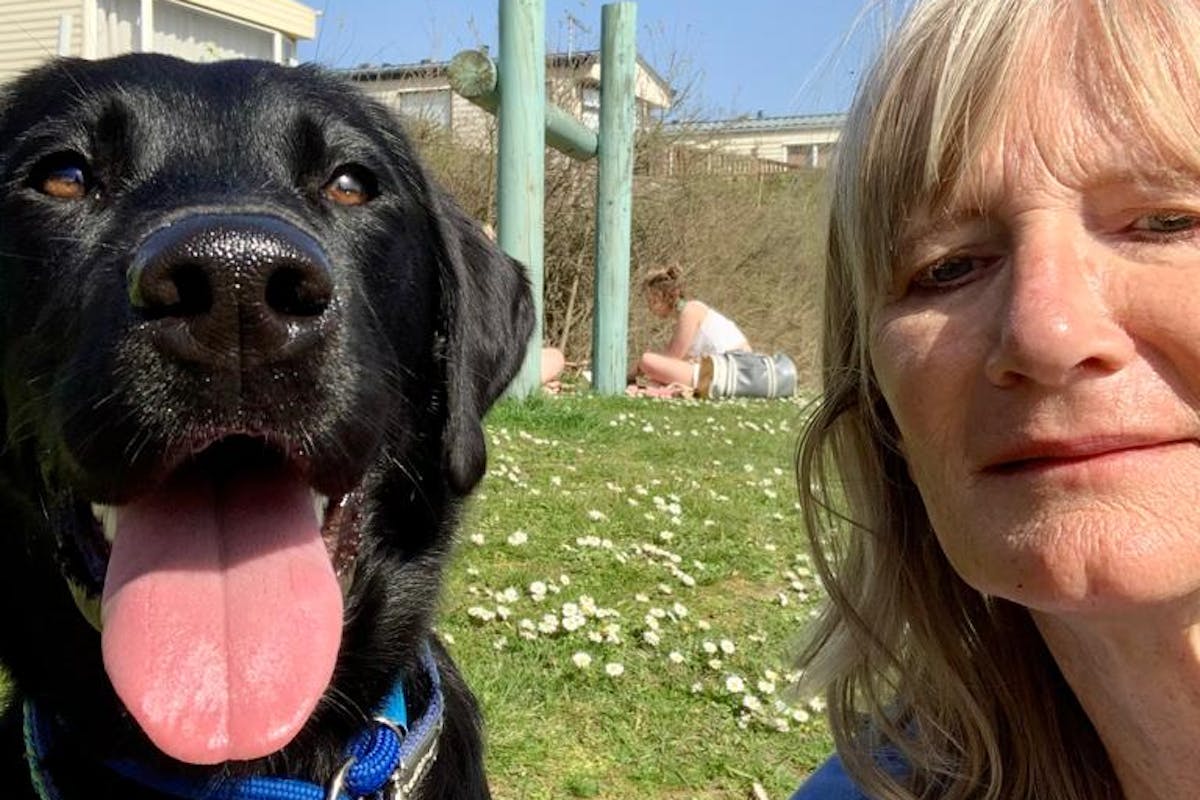 A dog and a woman taking a selfie together
