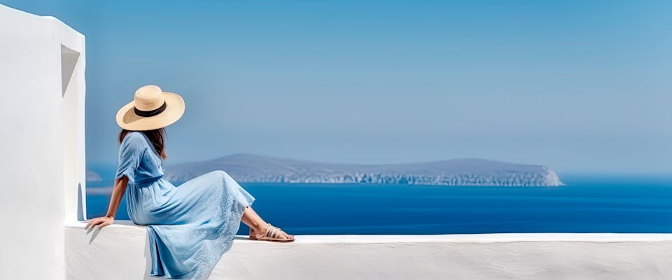 solo female traveler looking over a view on a Greek island