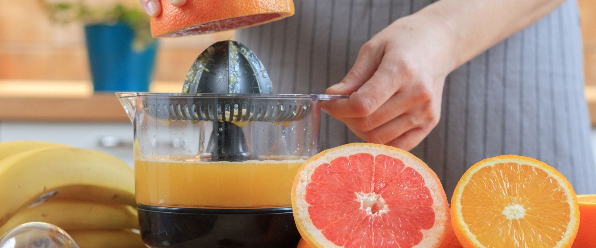 Grapefruit juice being squeezed