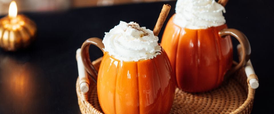 Pumpkin spice lattes in pumpkin-shaped mugs