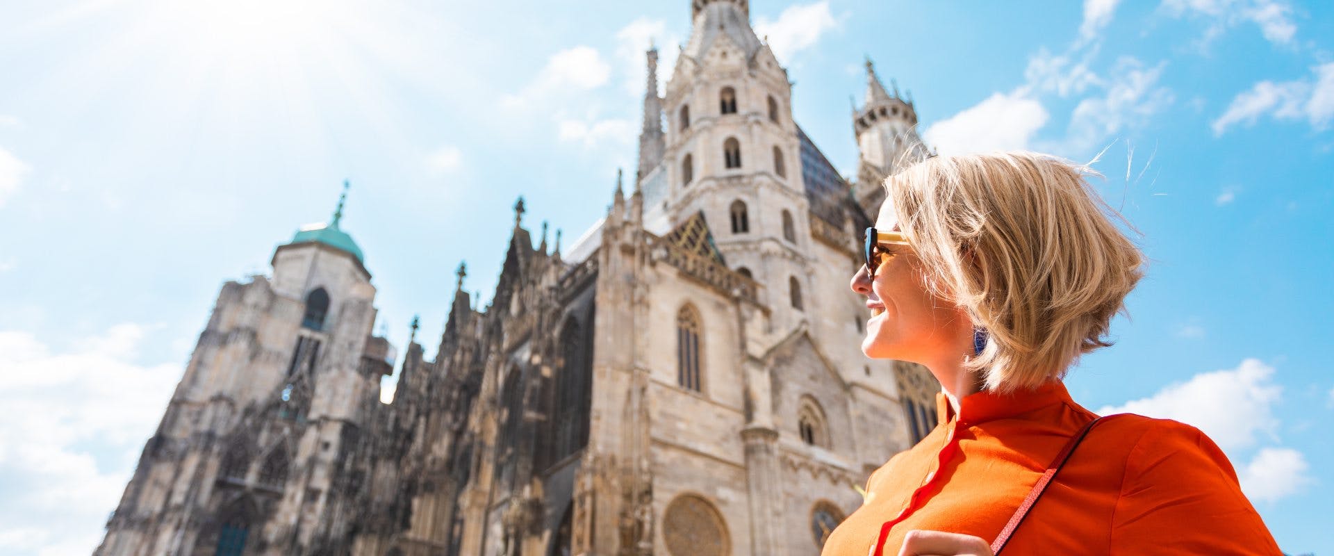 A solo female traveler outside St. Stephen’s Cathedral in Vienna.
