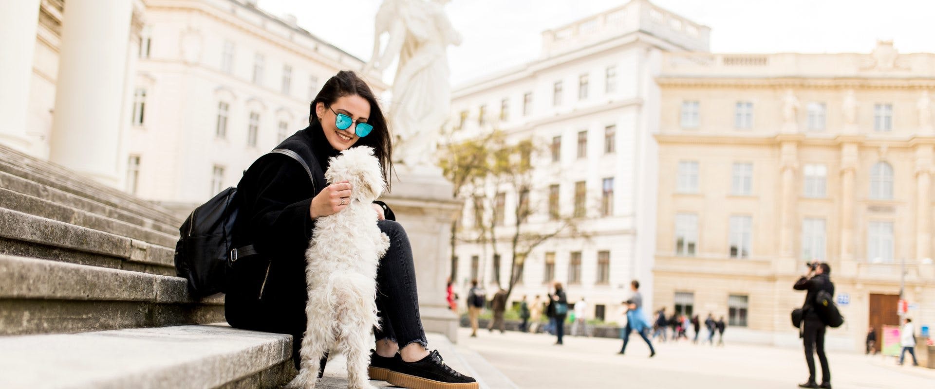 A solo female traveler pet sitter spending time with a dog in Vienna.