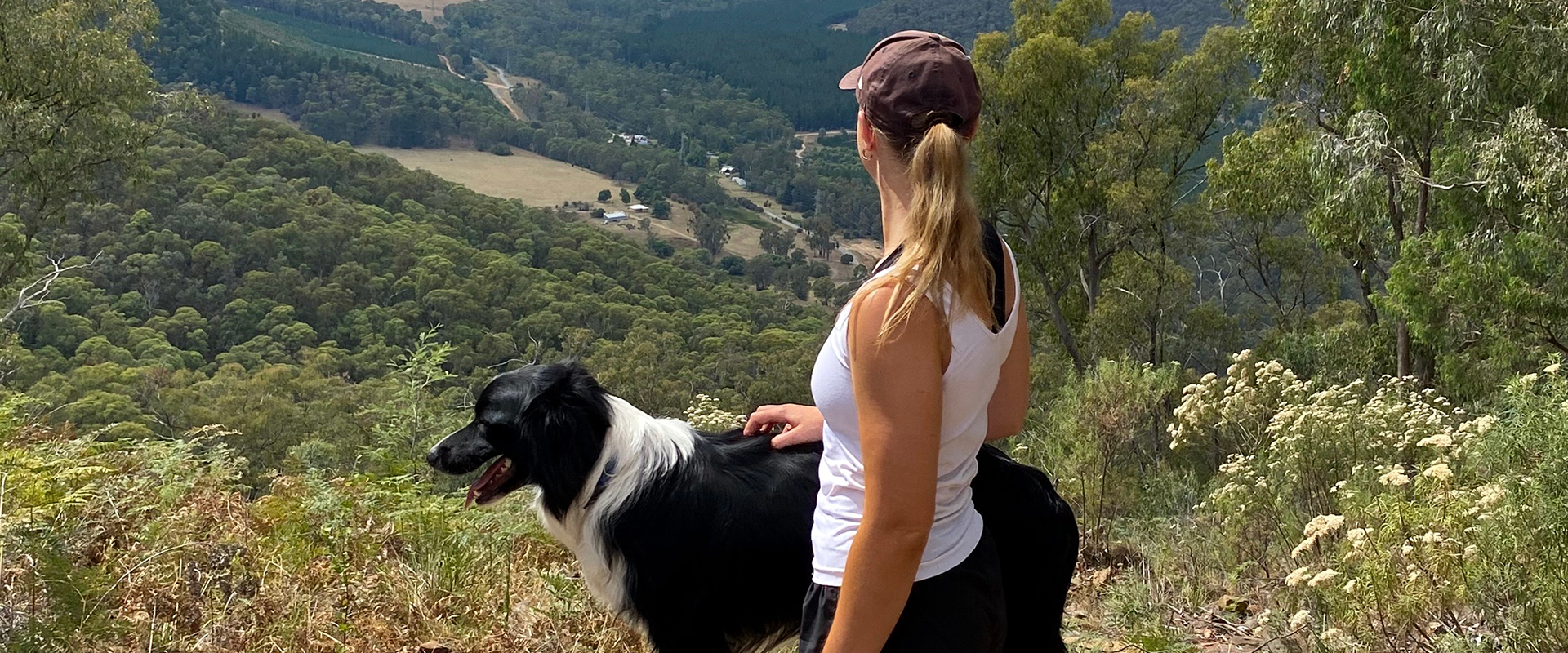 Woman hiking with a dog