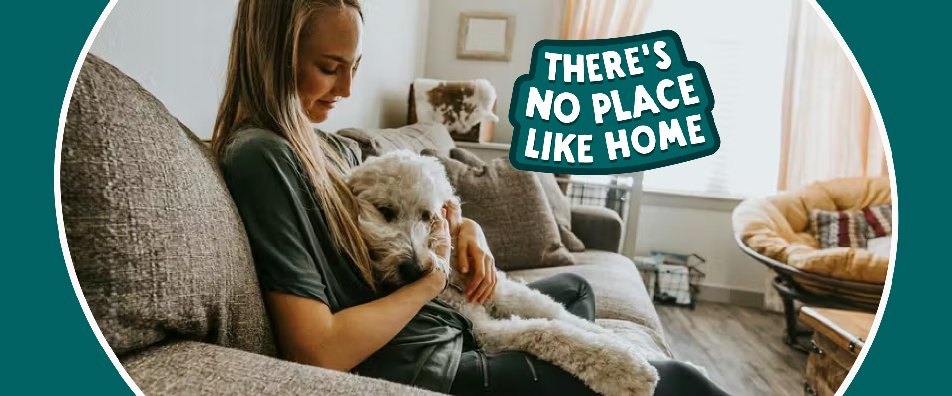 Person on the couch with a Labradoodle dog