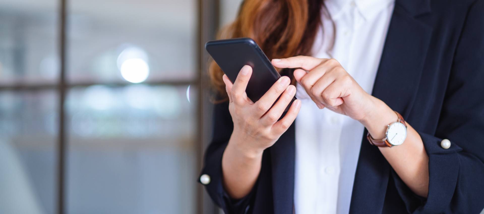 Woman scrolling on her mobile phone