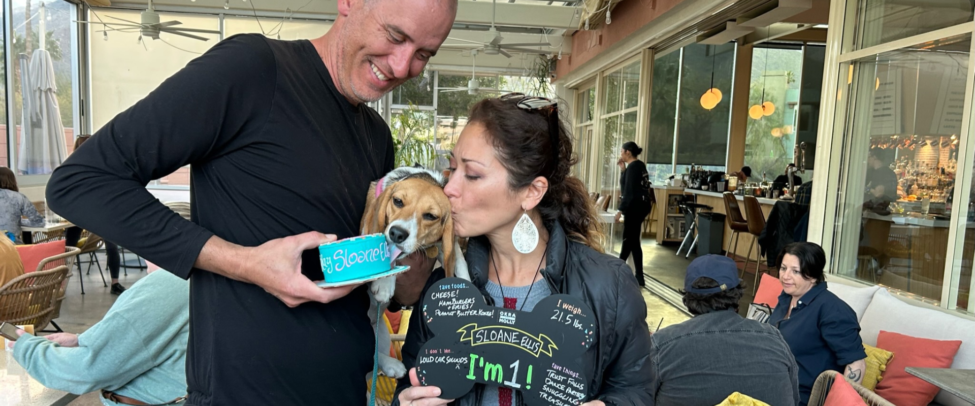 Sloane licks her cake as she celebrates her first birthday with her family.