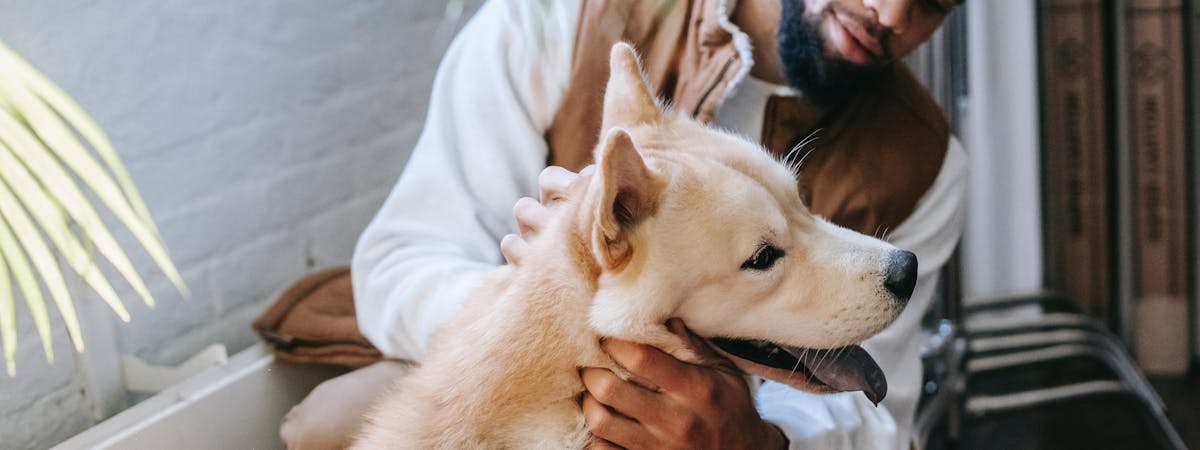 Man holding a dog