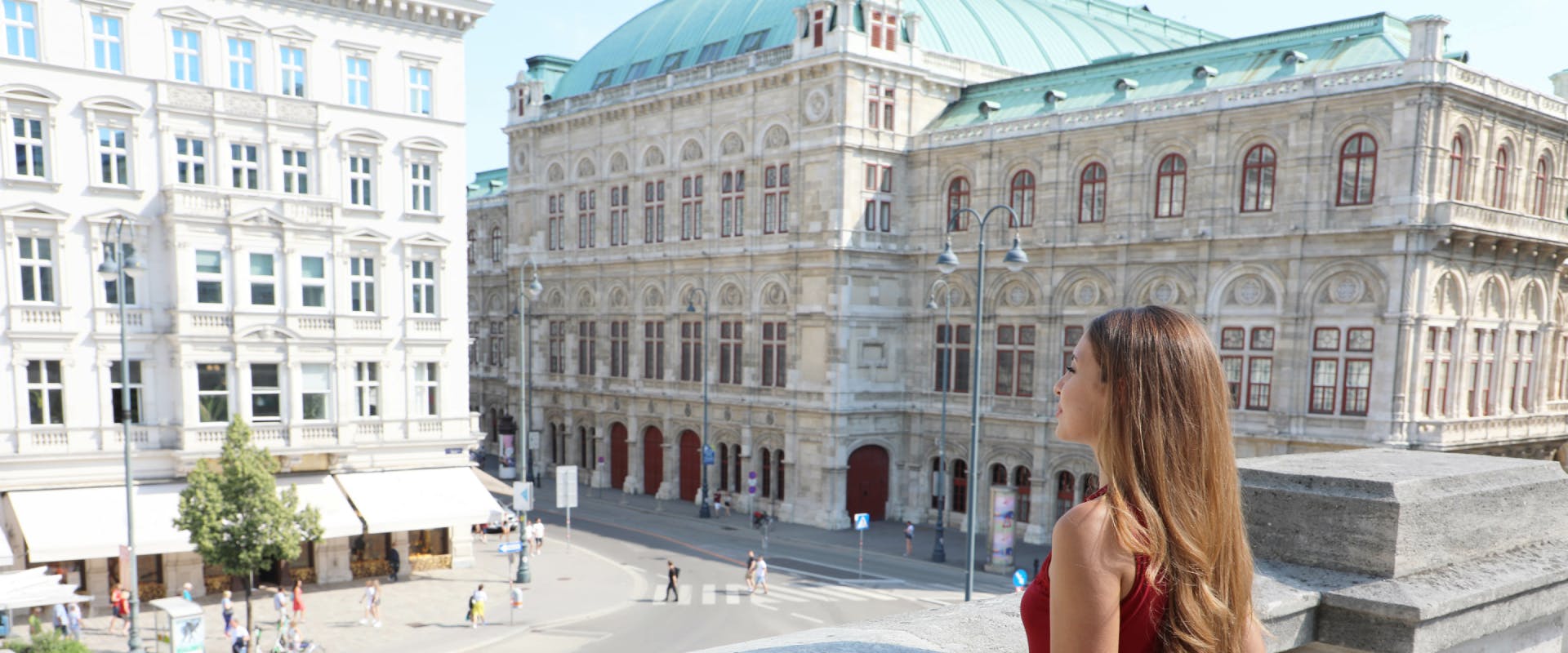 a solo female traveler stood next to the home to the danish crown jewels