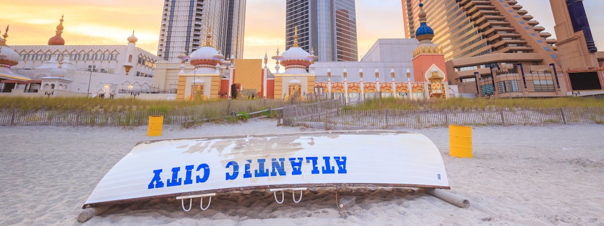 Upturned boat on the beach with the words 'Atlantic City' painted across it on, Atlantic City, USA