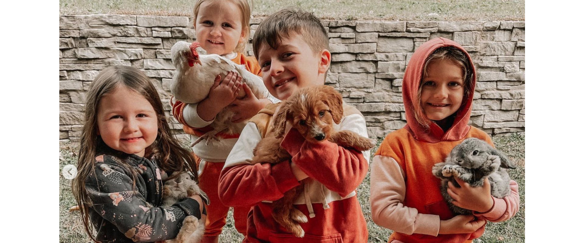 The children holding some animals.