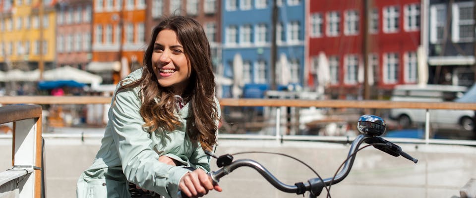 A woman on a bike in Amsterdam.