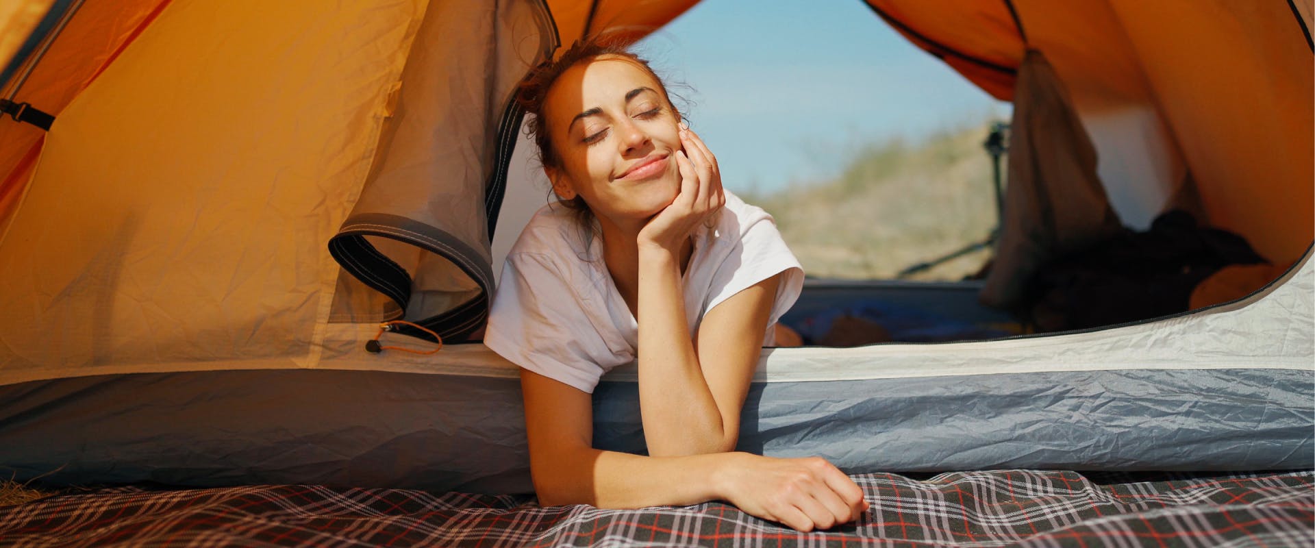 A woman camping.