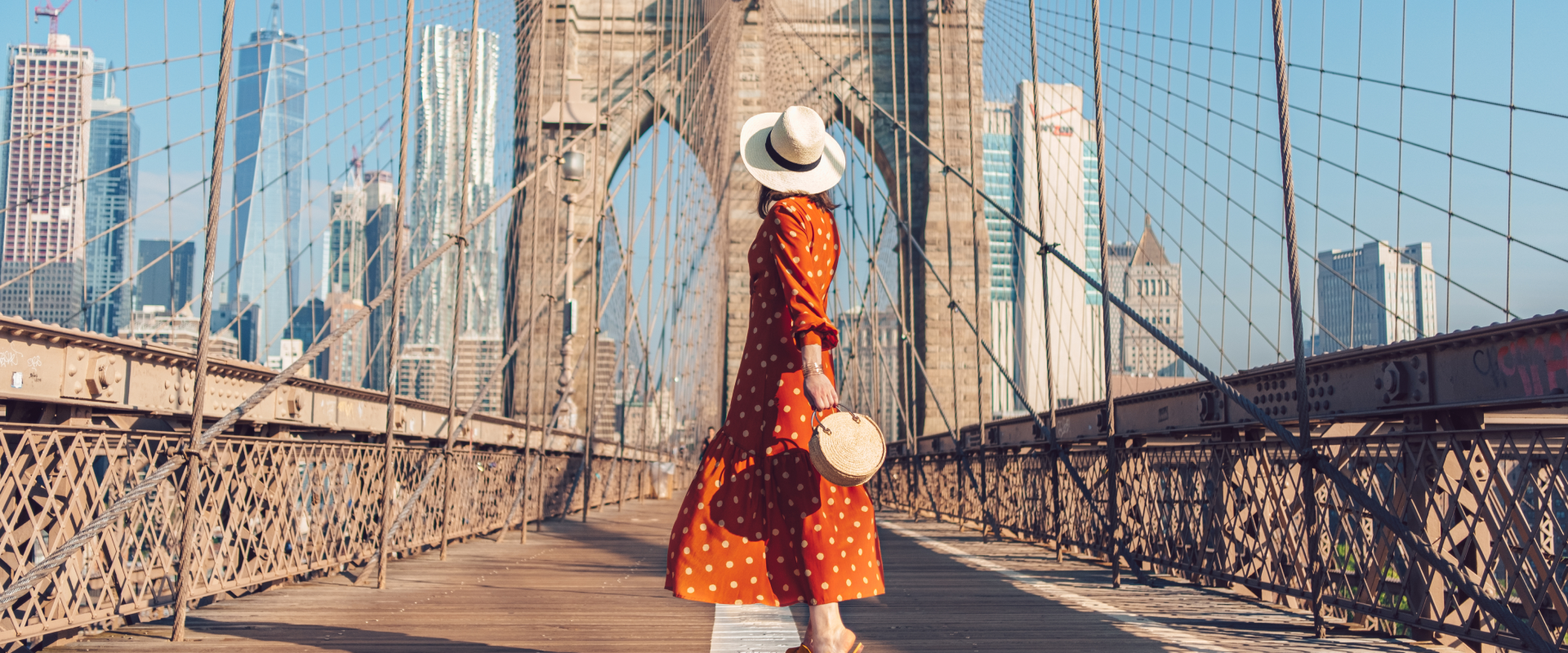 Woman in dress on bridge in New York City