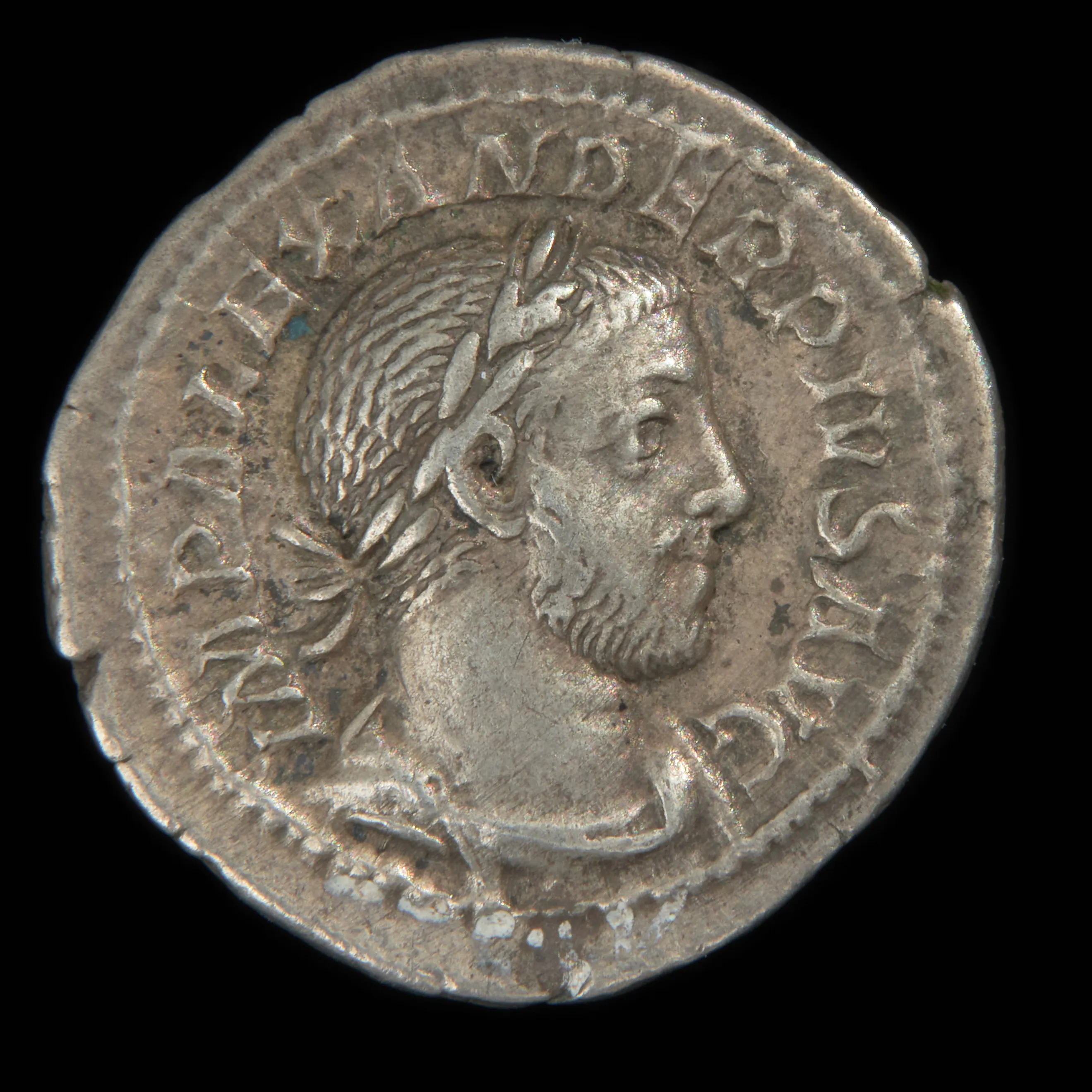 A Roman silver denarius of Alexander Severus, with the emperor's laureate portrait and the reverse figure of Spes, makes tangible the kind of compact ancient witness Ferrari preferred to pages of verbal dispute.