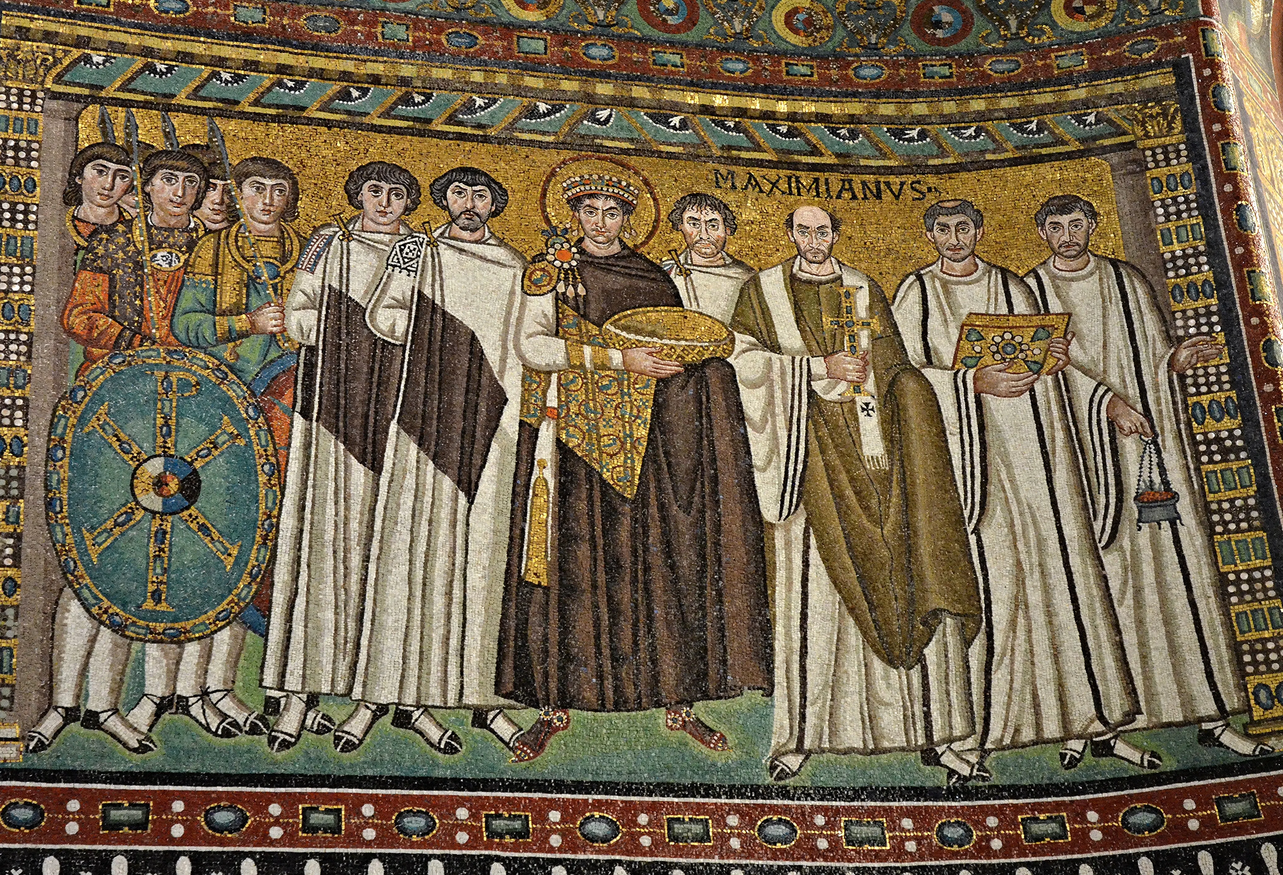 Justinian among clergy and armed attendants in the mosaic at San Vitale, Ravenna: a sixth-century image of imperial authority at once sacred and military. Ferretti, himself a Ravennate, built his naval jurisprudence on the Justinianic partnership of law and arms.