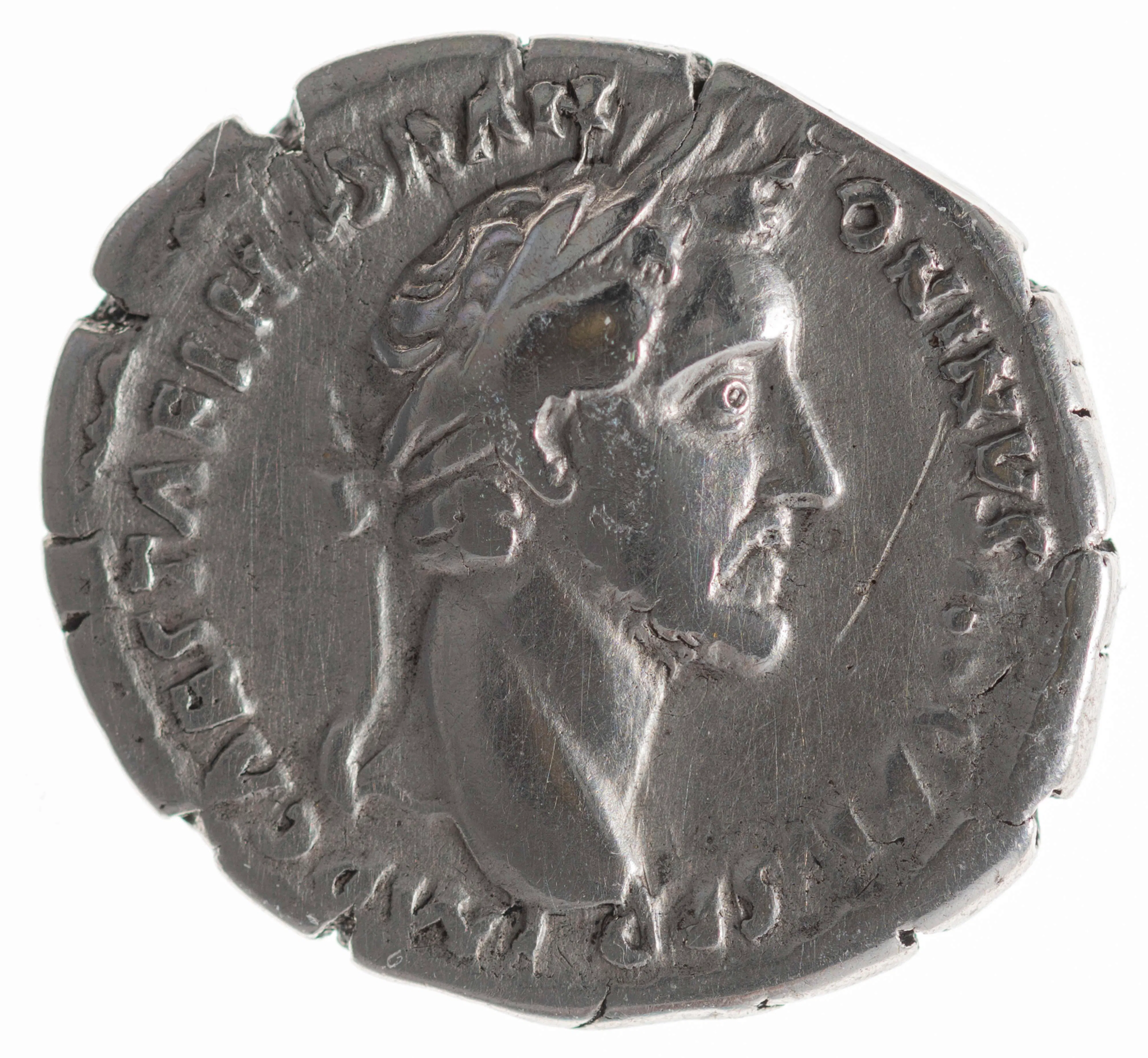 A Roman silver denarius such as this one, struck under Antoninus Pius, makes tangible the kind of evidence Budé brought to his desk: an imperial image and inscription joined to a measurable quantity of metal. In his hands, coins were instruments of correction, capable of weighing inherited manuscript numbers against the physical standards of Rome itself.