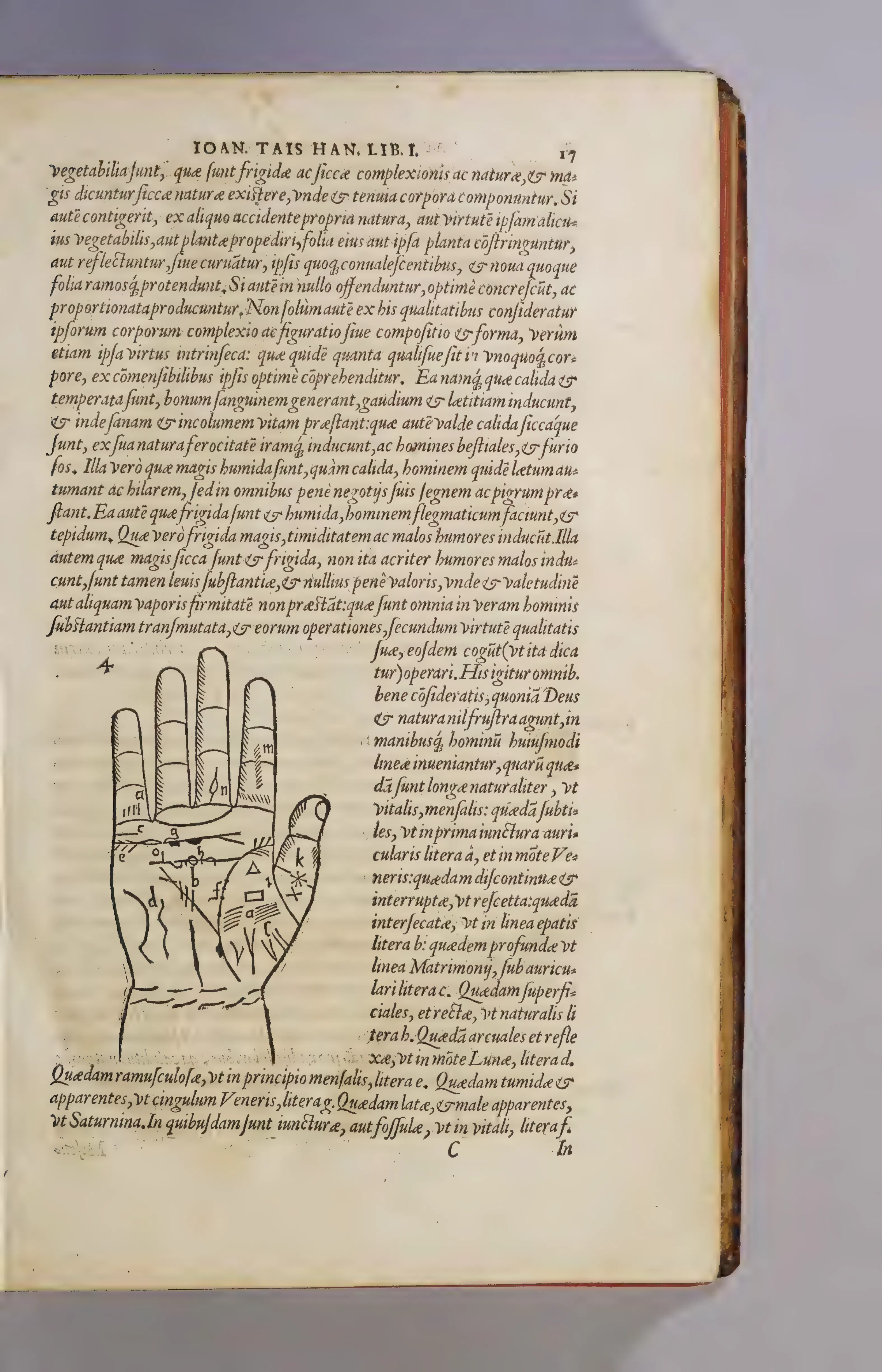 A page of Taisnier's Absolutissima Chyromantia, where the numbered hand and its lettered palmar features turn chiromantic reading into an apparatus of reference.