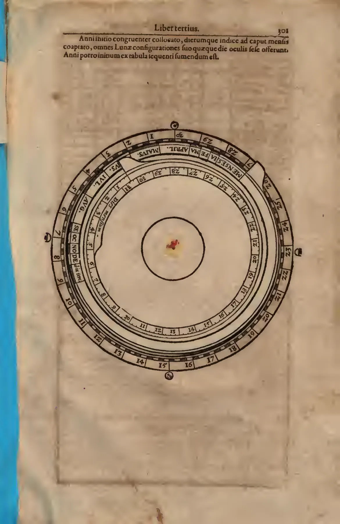 The printed lunar volvelle arranges months, day numbers, and solar and lunar phase signs into a concentric instrument.