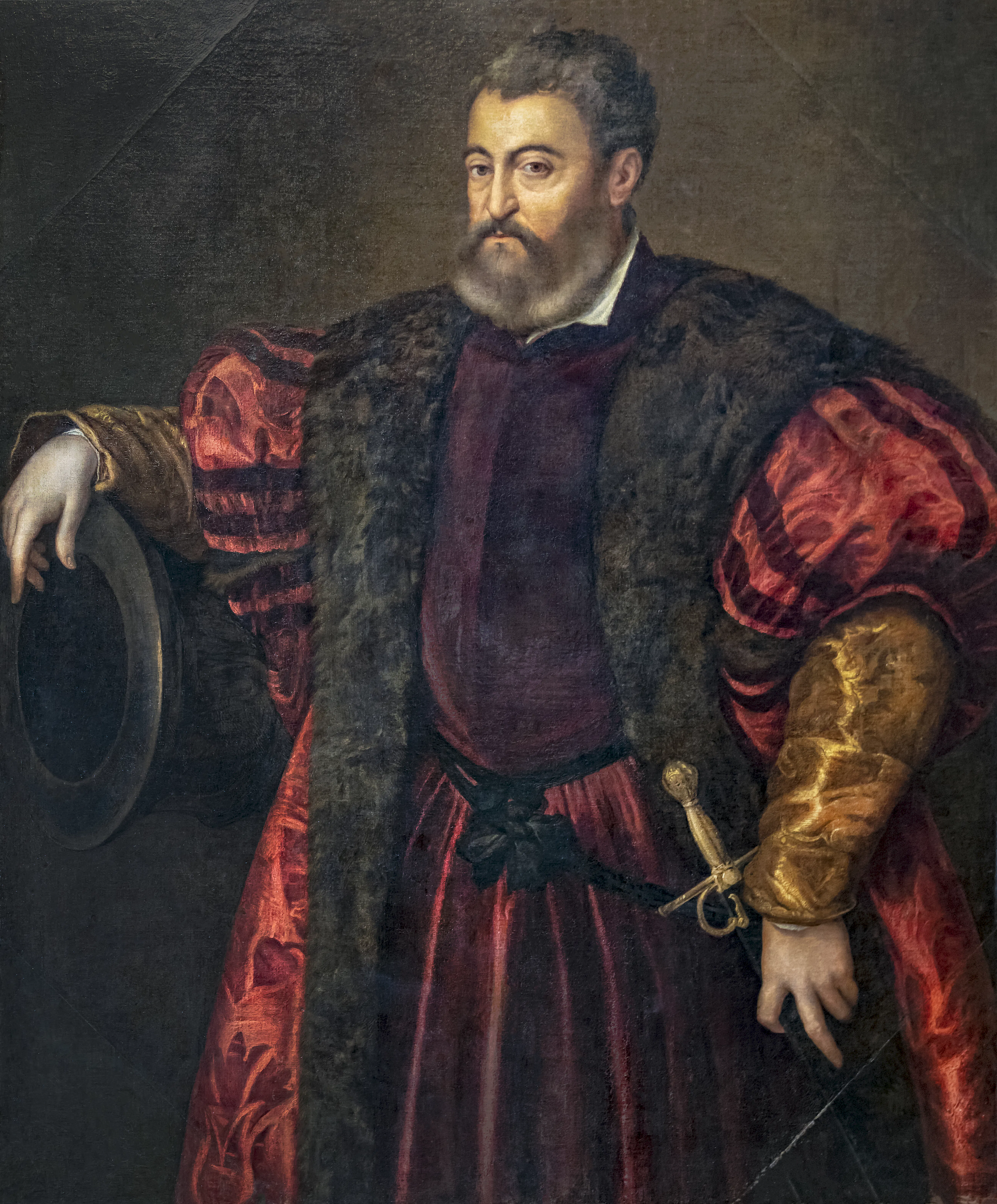 Identified as Titian's portrait of Alfonso I d'Este, this likeness evokes the martial and dynastic authority of the Ferrarese court into which Brasavola's career was woven, and the continuity between his service under Ercole II and the earlier Este world the dialogue repeatedly recalls.